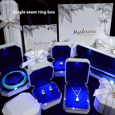 High-end LED gift box jewelry packaging set with illuminated necklace, ring, and wristwatch boxes in elegant white and blue design. Ideal for birthday gifts, proposals, or luxury jewelry presentation.